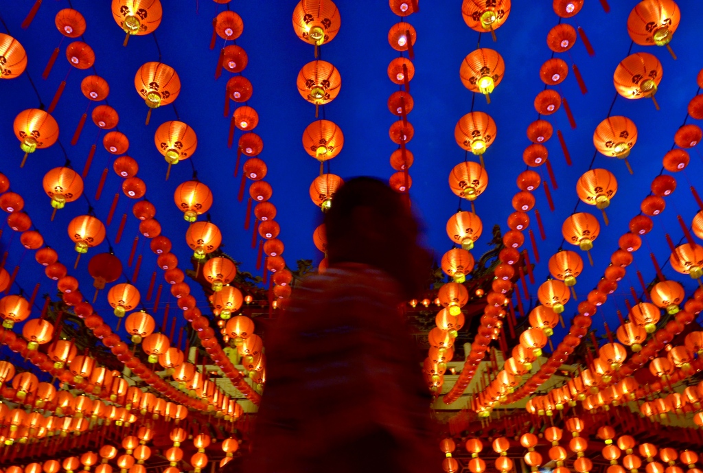 A man walk through the Thean Hou Temple on the  Chinese Lunar New Year of the horse in Kuala Lumpur on January 31 , 2014